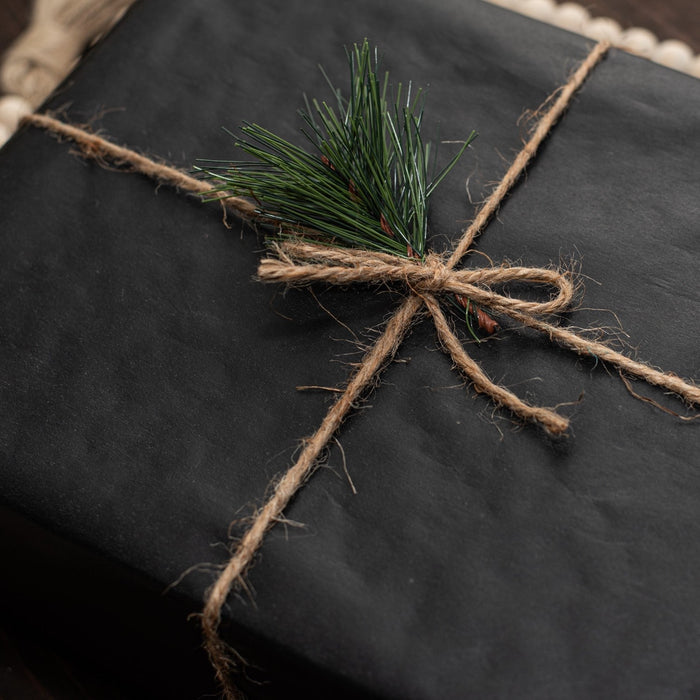 twine bow tied on holiday gift