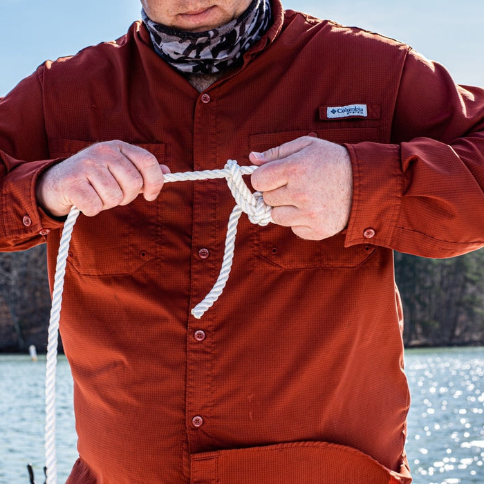 man tying an anchor knot